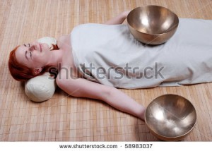 stock-photo-sound-massage-with-singing-bowls-58983037